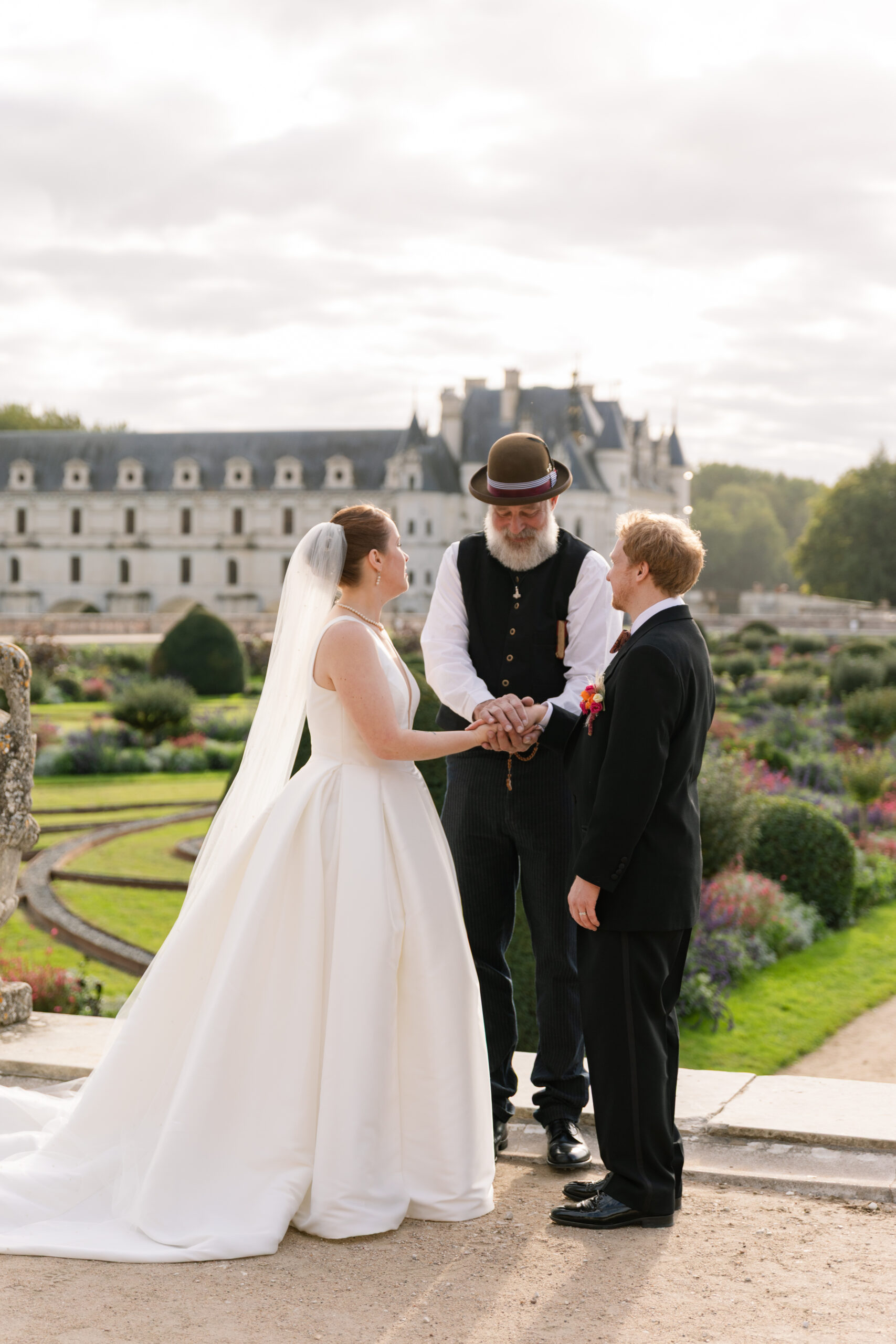 destination wedding photographer captures bride and groom during wedding ceremony at chateau de chenonceau